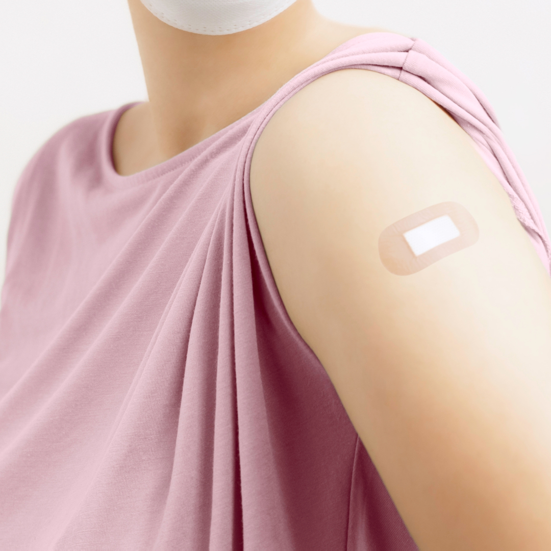 Woman shoulder after vaccine