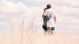 man and women in field